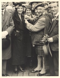 Sir Harry Pins Heather On Greta Lauder